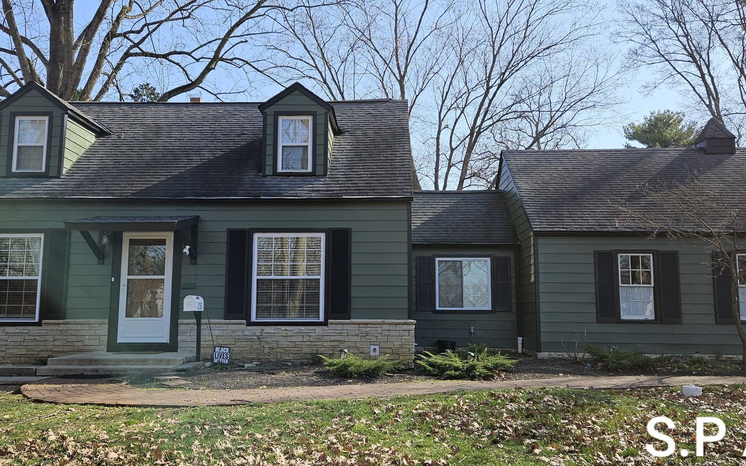 Cape cod house exterior painted green after — Segor Painting, Columbus OH