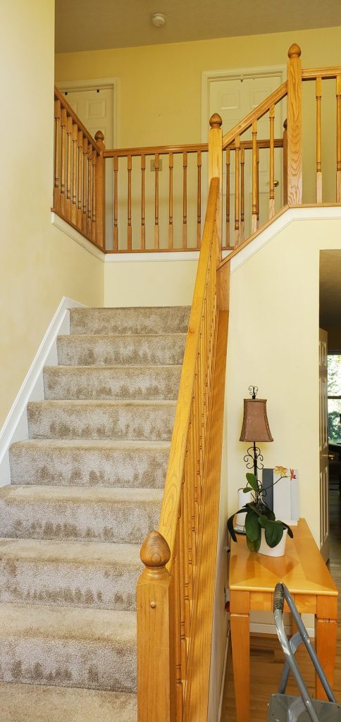 Staircase railing interior before — Segor Painting, Columbus OH