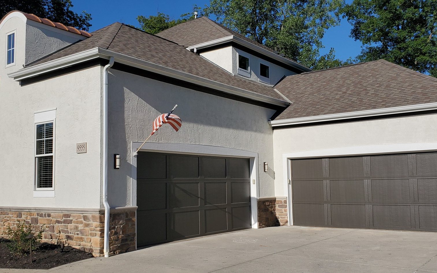 Stucco house garage doors painted after — Segor Painting, Columbus OH