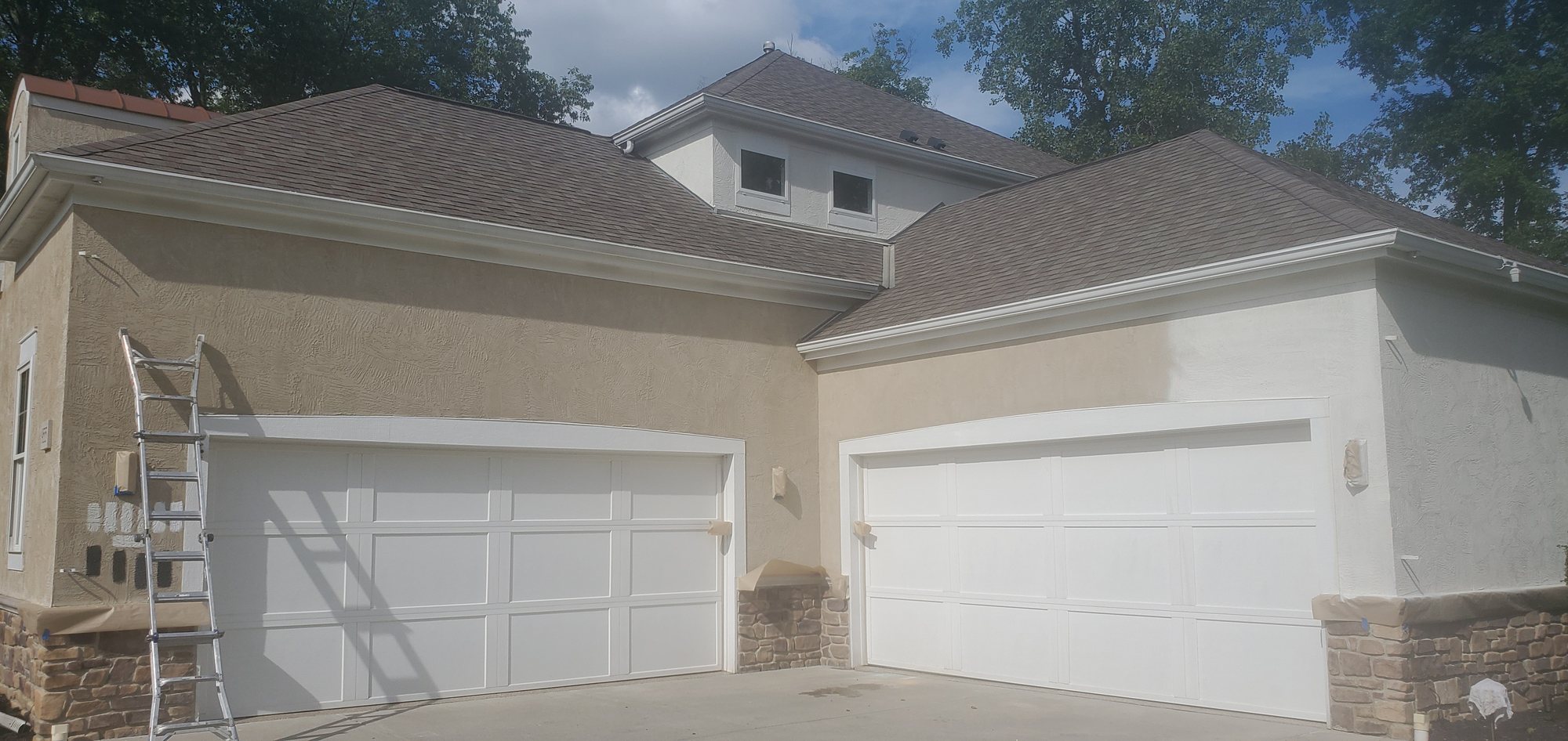 Stucco house garage doors painting in progress Stucco house garage doors painting in progress — Segor Painting, Columbus OH